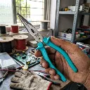 Electrician_holding_long_nose_plier_202605191034.webp