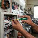 Electrician_holding_insulated_sc…_202605191820.webp