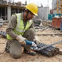 Male_worker_deburring_steel_rebar_202605241432.webp